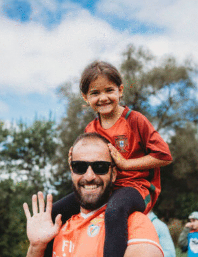 Man with his daughter on his shoulders