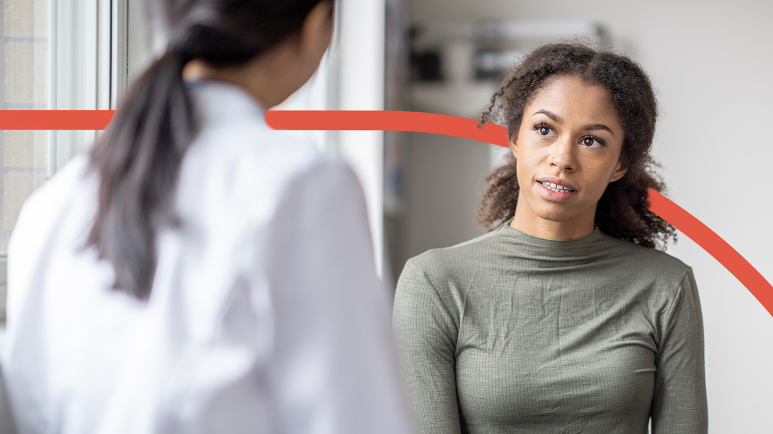 a women speaks to a doctor.