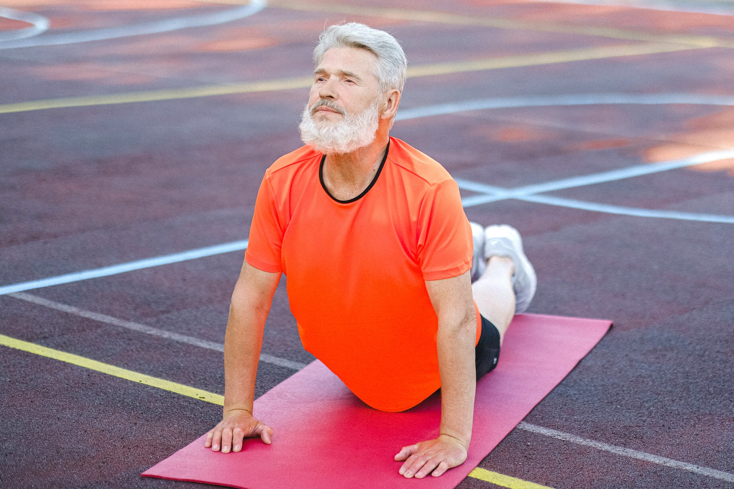 Man stretching on yoga mat